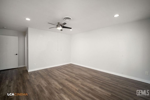 empty room with ceiling fan and dark hardwood / wood-style floors