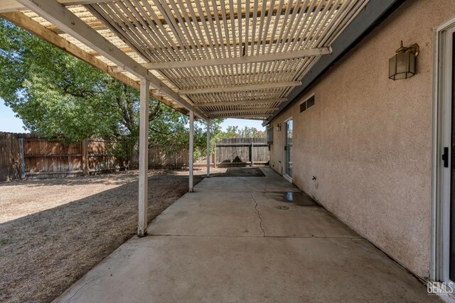 5928 Dyce Way, Bakersfield, CA 93306 - fenced backyard featuring a patio and a pergola
