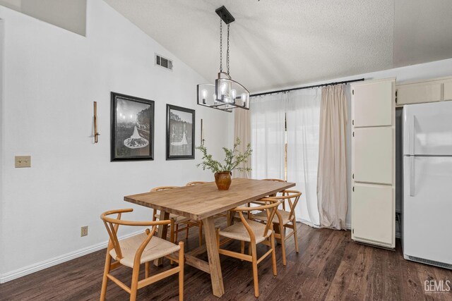 5928 Dyce Way, Bakersfield, CA 93306 - dining room featuring vaulted ceiling, dark wood-style flooring, a chandelier, and a textured ceiling