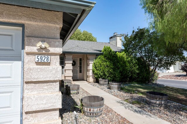 5928 Dyce Way, Bakersfield, CA 93306 - doorway to property featuring a chimney