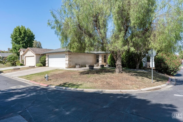 5928 Dyce Way, Bakersfield, CA 93306 - view of front of property featuring driveway, stucco siding, and an attached garage