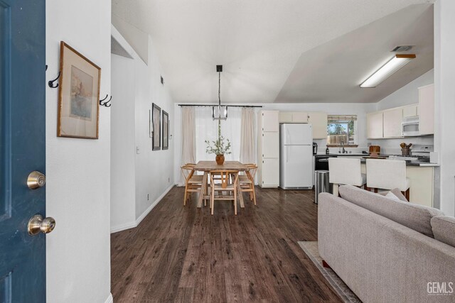 5928 Dyce Way, Bakersfield, CA 93306 - dining space with vaulted ceiling and dark wood finished floors
