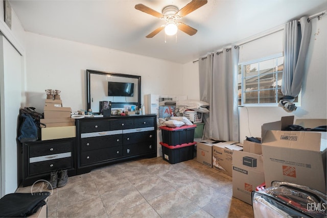 bedroom featuring light tile patterned floors and ceiling fan