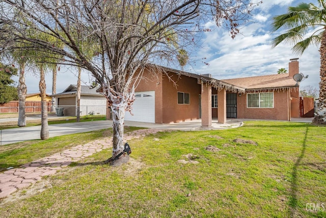 ranch-style home with a garage and a front lawn