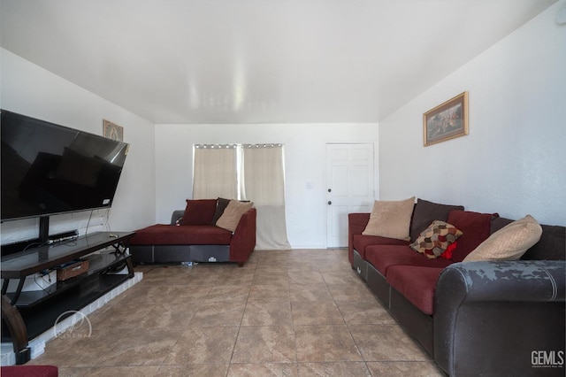 living room with tile patterned flooring