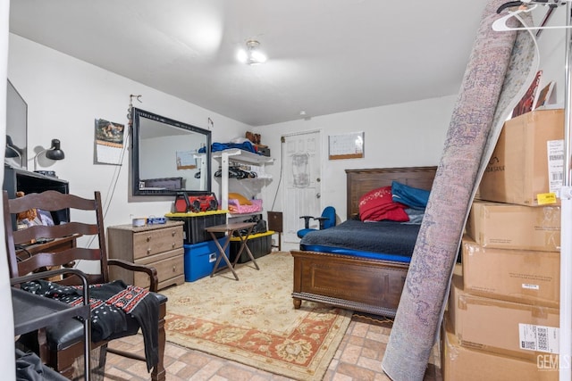 bedroom with brick floor