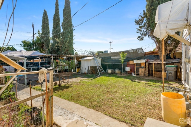 view of yard with an outbuilding and exterior structure