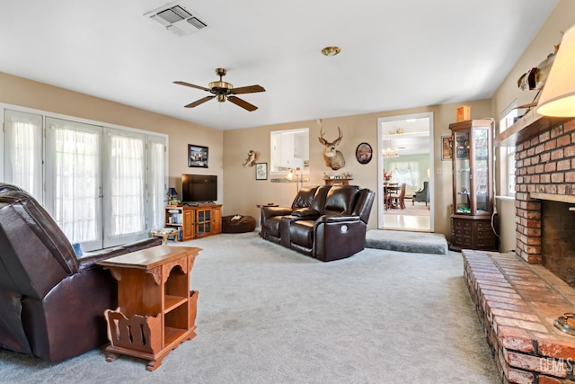 318 Cypress St, Bakersfield, CA 93304 - living area with plenty of natural light, carpet floors, ceiling fan, and a brick fireplace