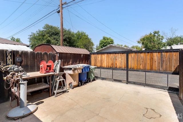 318 Cypress St, Bakersfield, CA 93304 - fenced backyard featuring a patio area and a storage unit