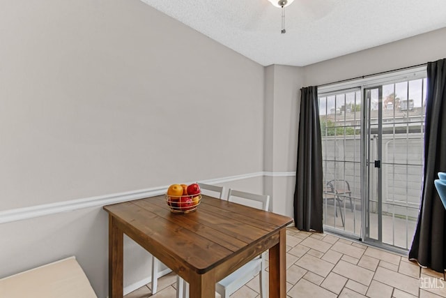 dining room with a textured ceiling