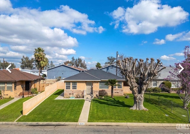 view of front of home with a front lawn