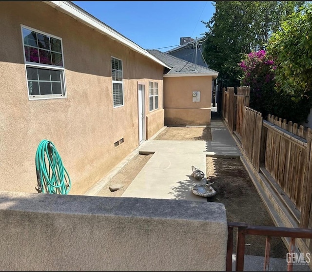 view of property exterior featuring a patio