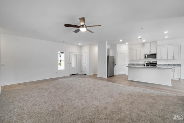 5016 Beaverhead Ave, Bakersfield, CA 93306 - unfurnished living room with ceiling fan, recessed lighting, and light wood-style floors