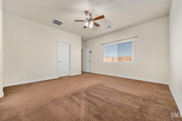 unfurnished room with visible vents, baseboards, carpet floors, and ceiling fan