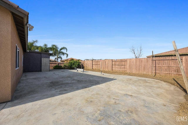 view of yard with a fenced backyard and a patio area