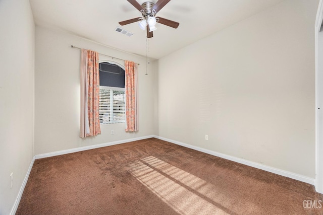 unfurnished room with carpet floors, baseboards, a ceiling fan, and visible vents