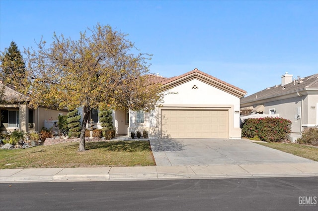 view of front of home featuring a garage and a front yard