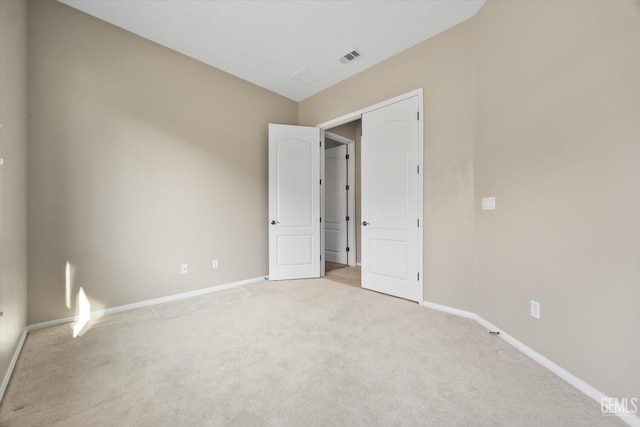 unfurnished bedroom with light carpet