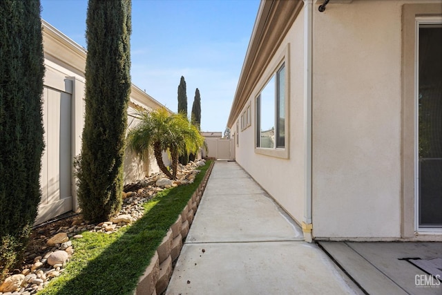 view of property exterior featuring a patio area