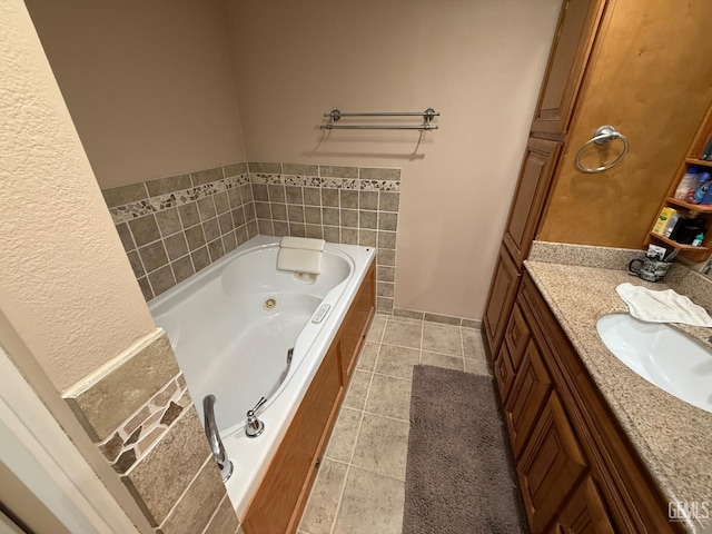 bathroom with vanity, tile patterned flooring, and a jetted tub