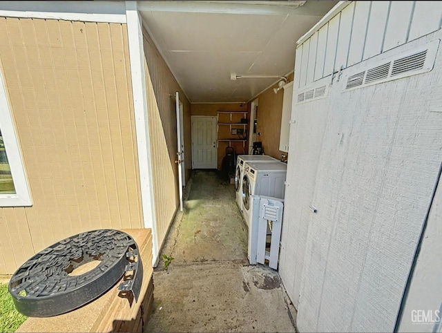 view of property exterior with washing machine and dryer