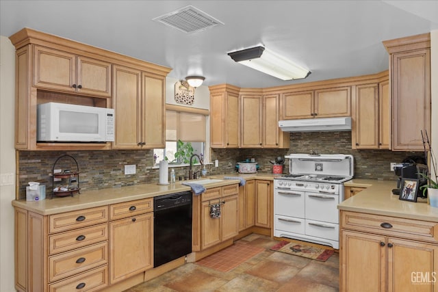 kitchen featuring light countertops, visible vents, backsplash, white appliances, and under cabinet range hood