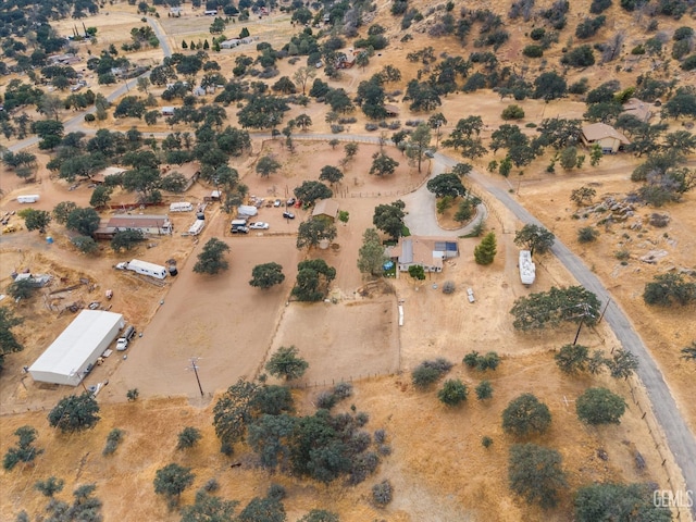 drone / aerial view featuring view of desert and a rural view