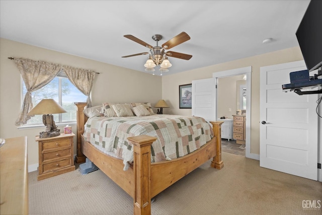 bedroom featuring ceiling fan, baseboards, and light colored carpet