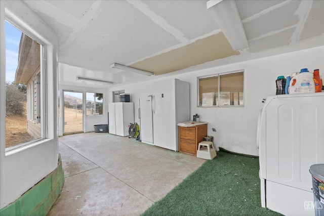 sunroom featuring washer / dryer