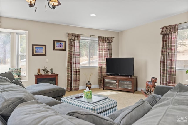 carpeted living room with baseboards