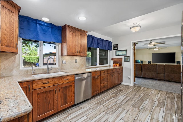 4512 Orrick Ct, Bakersfield, CA 93308 - kitchen featuring stainless steel dishwasher, tasteful backsplash, a ceiling fan, and brown cabinets