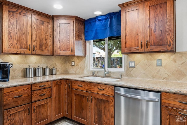 4512 Orrick Ct, Bakersfield, CA 93308 - kitchen featuring dishwasher, light stone countertops, and brown cabinetry