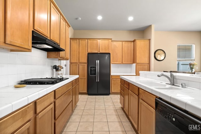 11901 Kimelford Dr, Bakersfield, CA 93312 - kitchen featuring fridge with ice dispenser, black dishwasher, under cabinet range hood, tile countertops, and decorative backsplash