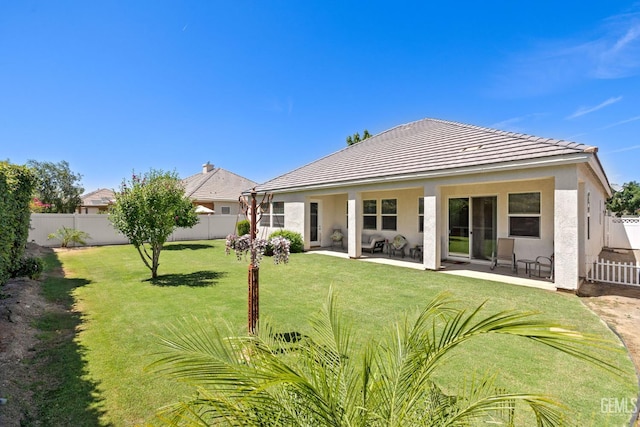 11901 Kimelford Dr, Bakersfield, CA 93312 - back of house with a fenced backyard, a tile roof, a patio area, and stucco siding