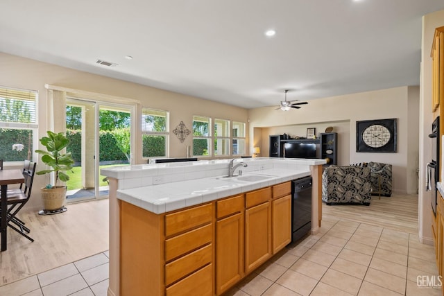 11901 Kimelford Dr, Bakersfield, CA 93312 - kitchen featuring black dishwasher, open floor plan, ceiling fan, light tile patterned flooring, and tile countertops