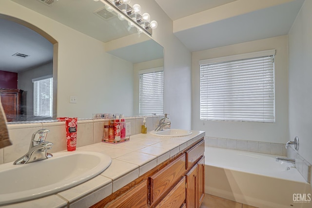 10126 Pyramid Peak Dr, Bakersfield, CA 93311 - bathroom featuring double vanity, a garden tub, and tile patterned flooring