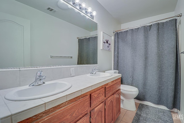 10126 Pyramid Peak Dr, Bakersfield, CA 93311 - bathroom featuring double vanity, tile patterned flooring, decorative backsplash, and curtained shower