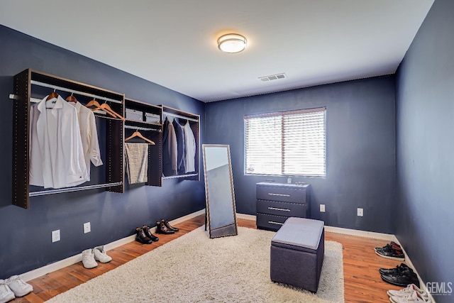 10126 Pyramid Peak Dr, Bakersfield, CA 93311 - walk in closet featuring wood finished floors