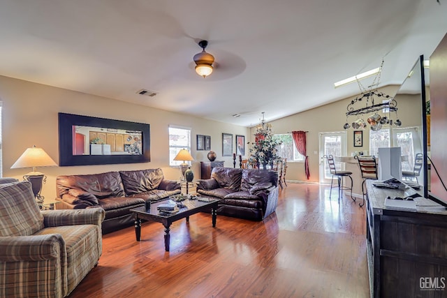 10126 Pyramid Peak Dr, Bakersfield, CA 93311 - living area with wood finished floors, a ceiling fan, and lofted ceiling