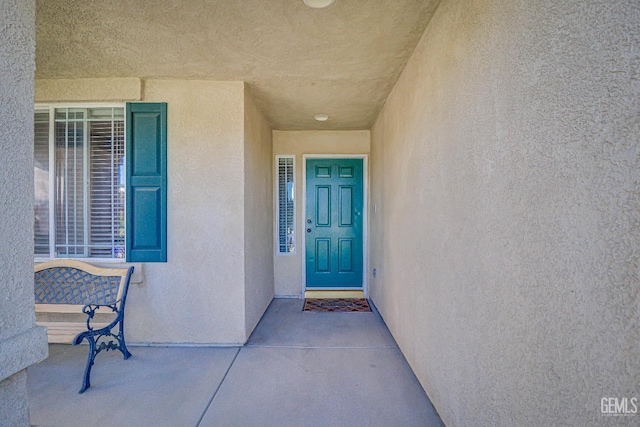10126 Pyramid Peak Dr, Bakersfield, CA 93311 - property entrance featuring stucco siding