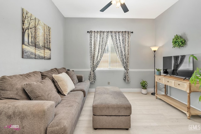 13918 Calico Village Dr, Bakersfield, CA 93306 - living room featuring wood finished floors, a ceiling fan, and baseboards