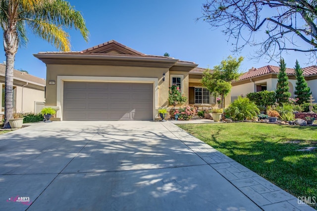 13918 Calico Village Dr, Bakersfield, CA 93306 - view of front facade featuring driveway, stucco siding, an attached garage, and a front lawn