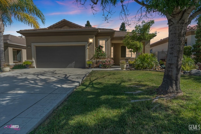 13918 Calico Village Dr, Bakersfield, CA 93306 - view of front facade with stucco siding, concrete driveway, an attached garage, and a lawn