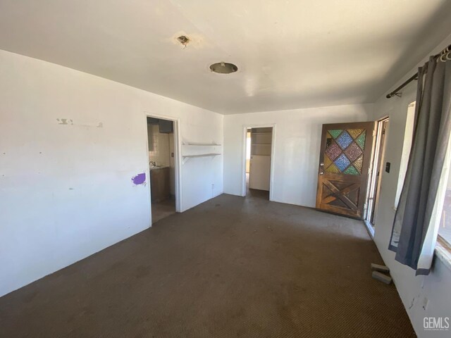 1509 Penny St, Bakersfield, CA 93306 - unfurnished bedroom featuring dark colored carpet and a closet
