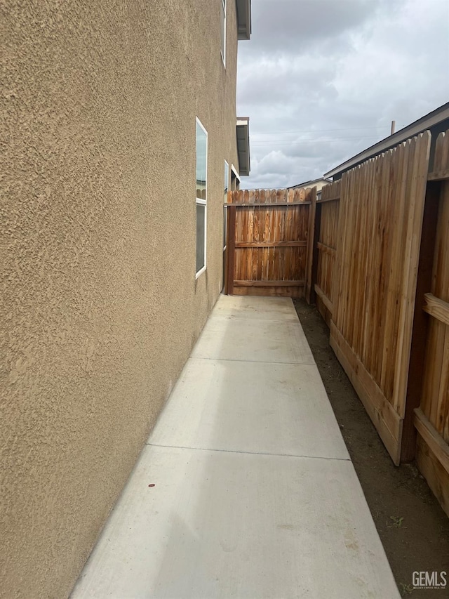 view of home's exterior featuring fence and stucco siding