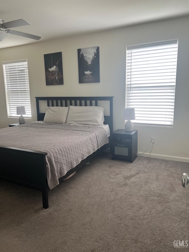 bedroom featuring carpet and baseboards