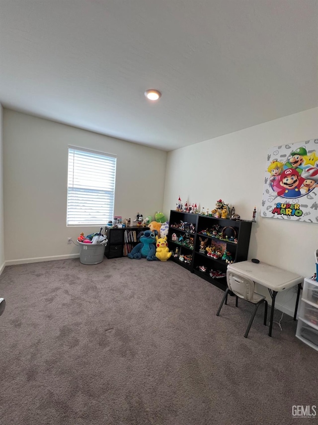 game room with carpet floors and baseboards