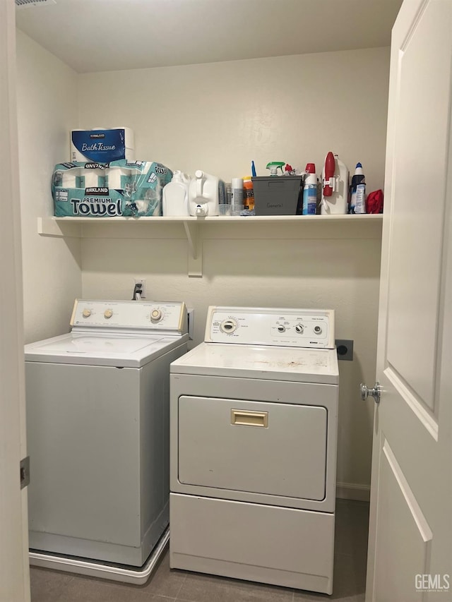 laundry room featuring laundry area and washing machine and clothes dryer