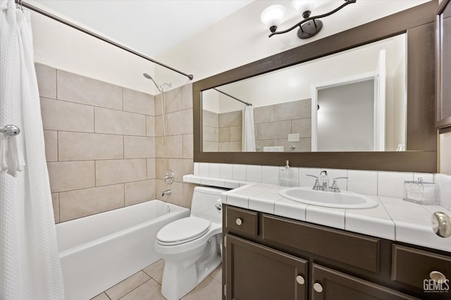 full bathroom featuring tile patterned flooring, vanity, shower / bathtub combination with curtain, and toilet