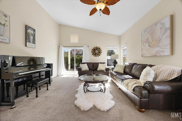 living room featuring high vaulted ceiling, light carpet, and ceiling fan